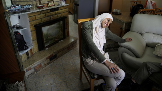 File photo: Arab-Israeli poet Dareen Tatour, 35, laughs during an interview