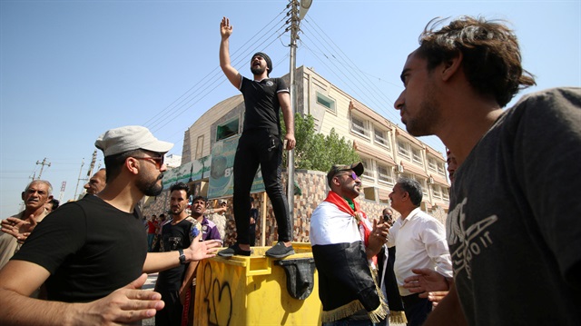 File Photo: Iraqi men shout slogans during a protest in front of Basra provincial council building, demanding jobs and better state services, in Basra, Iraq.