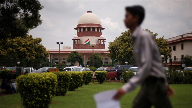 A man walks inside the premises of the Supreme Court in New Delhi, India