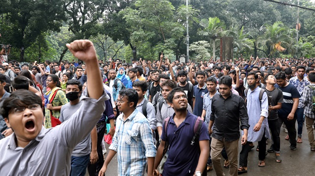 Students shout slogan during a rally as they join in a protest over recent traffic accidents that killed a boy and a girl, in Dhaka, Bangladesh.
