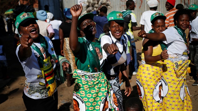 Supporters of President Emmerson Mnangagwa's ruling ZANU-PF party gather to celebrate his election victory in Harare, Zimbabwe.
