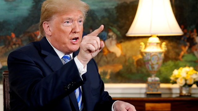 FILE PHOTO: U.S. President Donald Trump speaks to reporters after signing a proclamation declaring his intention to withdraw from the JCPOA Iran nuclear agreement in the Diplomatic Room at the White House in Washington, U.S.