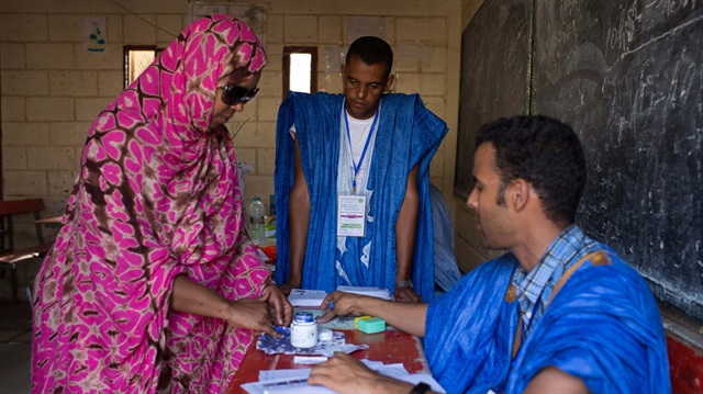 File photo: A woman has her finger dipped in ink after voting during the presidential elections in Nouakchott