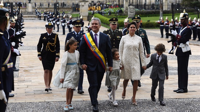Colombia's new President Ivan Duque walks with his family in Bogota, Colombia.