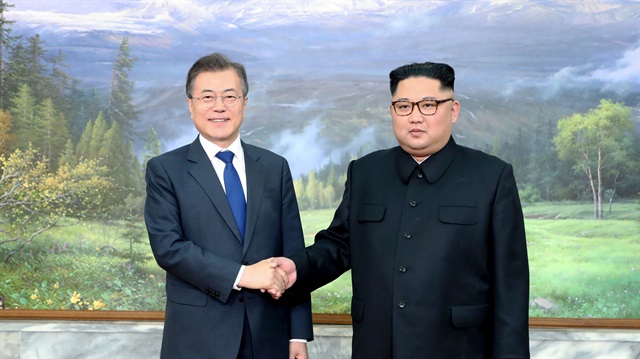 File photo: South Korean President Moon Jae-in shakes hands with North Korean leader Kim Jong Un during their summit at the truce village of Panmunjom, North Korea, in this handout picture provided by the Presidential Blue House 