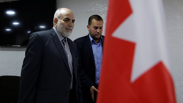Mohammed Awad al-Zyoud (L), secretary general of the Islamic Action Front