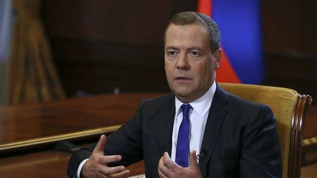 Russian Prime Minister Dmitry Medvedev speaks during an interview with Russia's Kommersant newspaper at the Gorki state residence outside Moscow