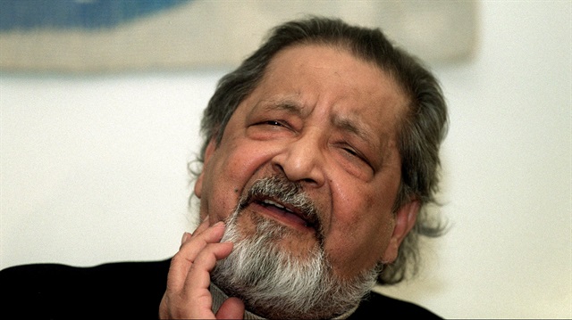 Writer V.S. Naipaul waits to receive his Nobel prize for literature 