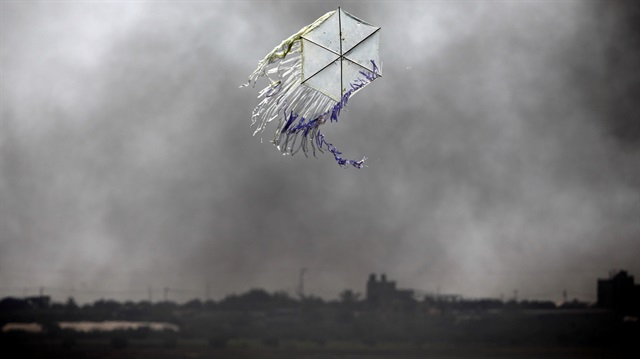 A kite flies over the border