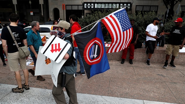 People gather at Freedom Plaza to protest the white supremacist Unite the Right rally held in front of the White House on the one year anniversary of the white supremacist rally in Charlottesville, VA, in downtown Washington, U.S.