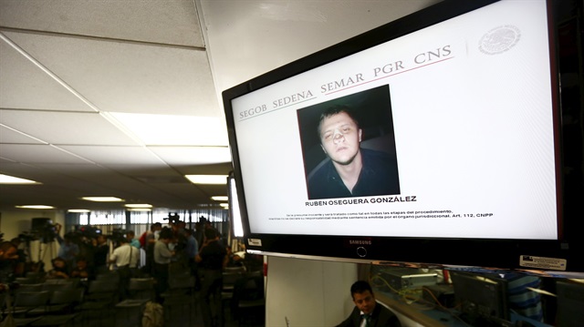 File photo: A mugshot of Ruben Oseguera Gonzalez is displayed on a screen during a news conference
