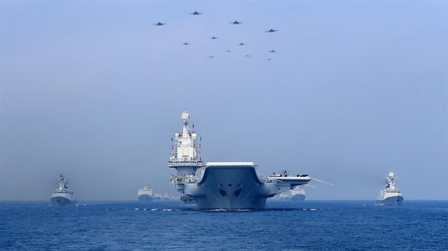 File Photo: Warships and fighter jets of Chinese People's Liberation Army (PLA) Navy take part in a military display in the South China Sea.