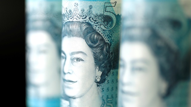 File photo: British five pound banknotes are seen in this picture illustration