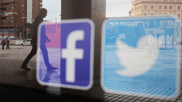 File photo: Facebook and Twitter logos are seen on a shop window