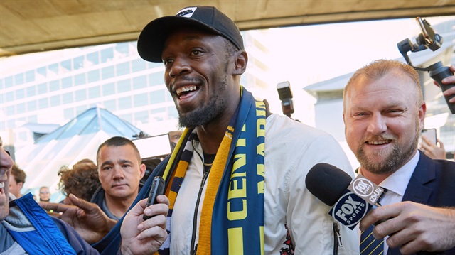 Eight-time Olympic champion Usain Bolt reacts as he arrives at Sydney Airport 