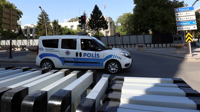 A police car is parked in front of the U.S. Embassy in Ankara