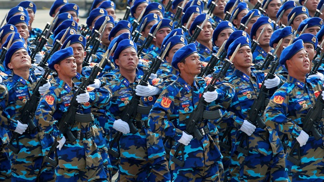 Vietnamese coast guard servicemen hold rifles while marching during a celebration to mark National Day in Hanoi, Vietnam September 2, 2015. 
