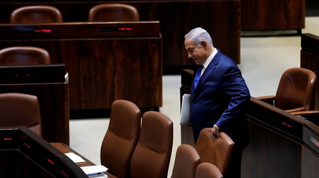 Israeli Prime Minister Benjamin Netanyahu arrives to the plenum of the Knesset