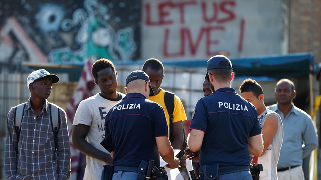 Italian police identifies migrants in a camp set by the Baobab aid group in Rome, Italy July 12, 2018. 