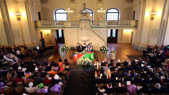 People attend a ceremony in Berlin, Germany, August 29, 2018, to hand back human remains from Germany to Namibia following the 1904-1908 genocide against the Herero and Nama 