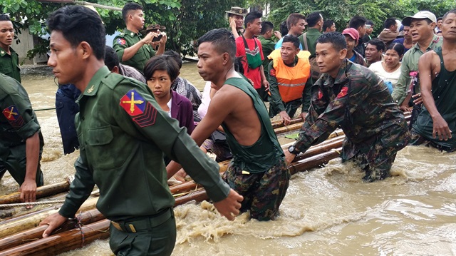 People are evacuated by Myanmar soldiers after flooding in Swar township, Myanmar August 29, 2018. 