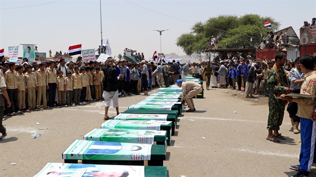 Mourners attend a funeral of people, mainly children, killed in a Saudi-led attack