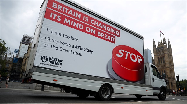 A van with a campaign poster about Brexit is driven around Parliament Square in London, Britain September 4, 2018. 