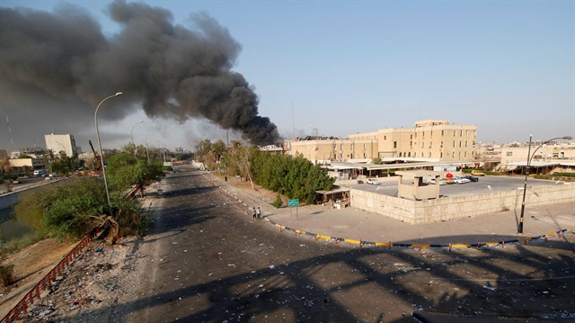 Smoke rises from the governorate and municipalities buildings of Basra, Iraq September 6, 2018.