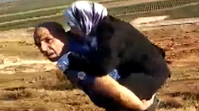 Başpolis, Suriyeli yaralı kadını sırtında 2 kilometre taşımıştı. 