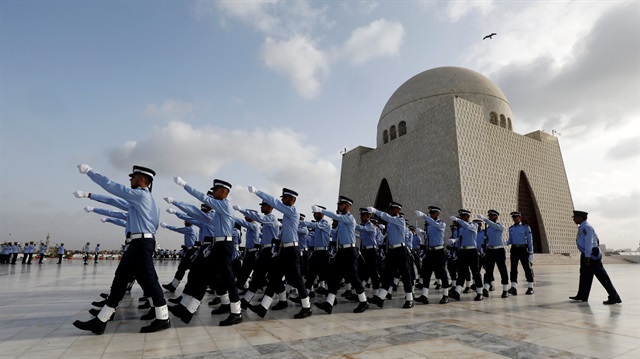 Members of the Pakistan air force march past the mausoleum of Muhammad Ali Jinnah during Defence Day ceremonies, or Pakistan's Memorial Day, in Karachi, Pakistan September 6, 2018.