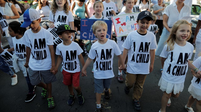 File photo: Children hold hands during a march to mark “the court-ordered deadline for the Trump Administration to reunify thousands of families separated at the border, in Washington, U.S., July 26, 2018.