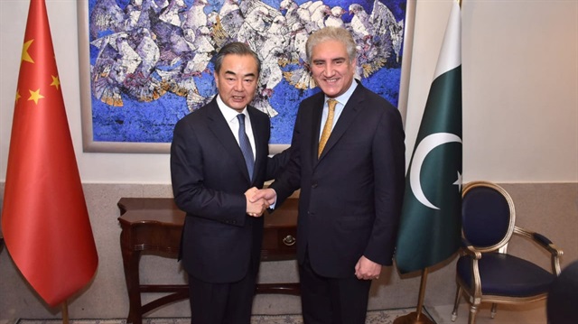 Pakistan's Foreign Minister Shah Mehmood Qureshi shakes hand with State Councillor and Foreign Minister Wang Yi at the Ministry of Foreign Affairs in Islamabad, Pakistan.