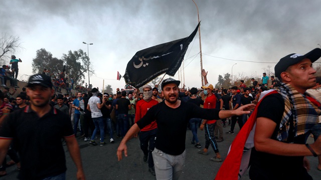 Iraqi protesters gather during an anti-government protest near the building of the government office in Basra, Iraq September 7, 2018