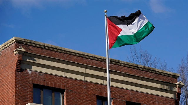 Palestinian flag waves at Palestine Liberation Organization office in Washington, U.S., 