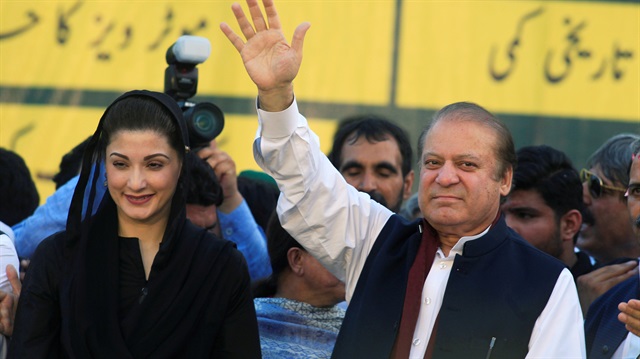 File photo: Nawaz Sharif (R), former Prime Minister and leader of Pakistan Muslim League, gestures to supporters as his daughter Maryam Nawaz