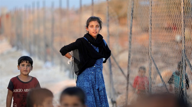 Newly displaced Syrian children arrive to a refugee camp in Atimah village, Idlib province, Syria September 11, 2018.