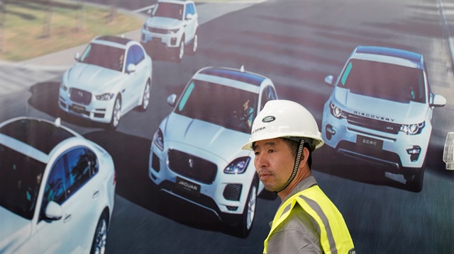 File photo: An employee walks inside the Chery Jaguar Land Rover plant phase 2 after the phase 2 opening ceremony in Changshu, Jiangsu province, China 
