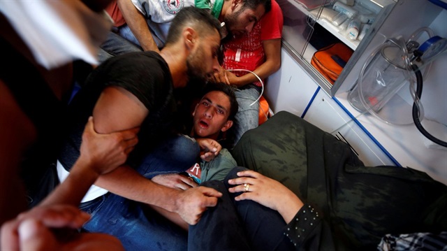 İşgalci İsrail'in saldırısında yaralanan bir Filistinli.