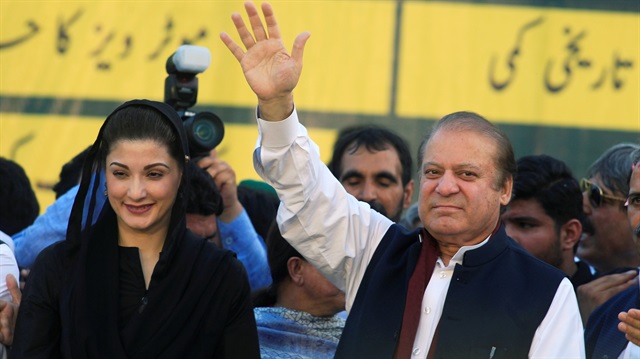 Nawaz Sharif (R), former Prime Minister and leader of Pakistan Muslim League, gestures to supporters as his daughter Maryam Nawaz looks on during party's workers convention in Islamabad, Pakistan June 4, 2018. 