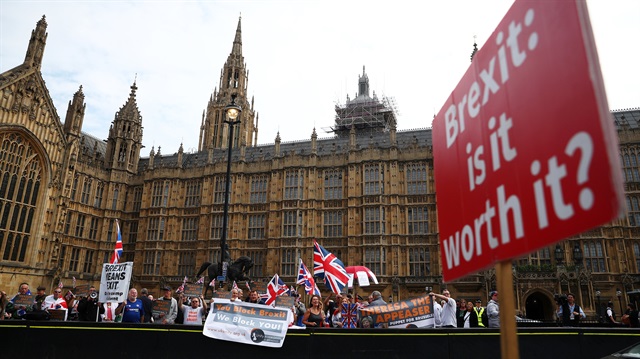 Pro and anti Brexit protesters demonstrate on opposite sides of the road outside the Houses of Parliament in London, Britain, September 5, 2018.