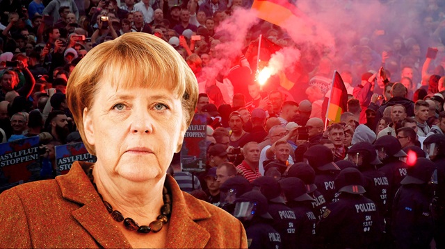 Almanya'nın Chemnizt kentinde Neo-Nazi grupların protestosuyla başlayan tartışmalarda 'Merkel istifa' pankartları yer aldı.