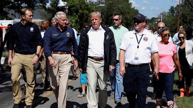 U.S. President Donald Trump tours Hurricane Florence damage with South Carolina Governor Henry McMaster (2ndL) in Conway, South Carolina, U.S., September 19, 2018. 
