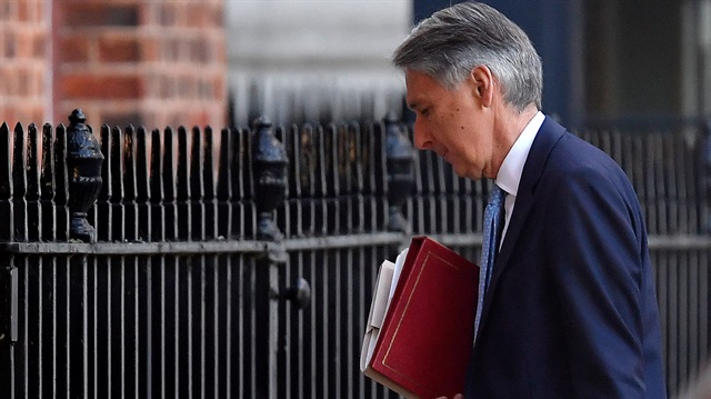 Britain's Chancellor of the Exchequer Philip Hammond arrives in Downing Street 