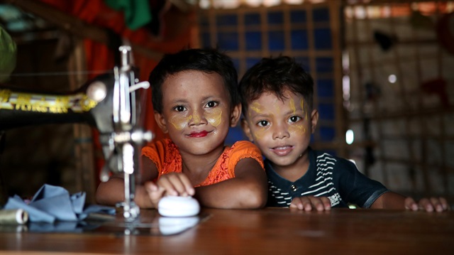 Rohingya refugee children pose for a picture in their makeshift tent in the Balukhali refugee camp in Cox's Bazar, Bangladesh