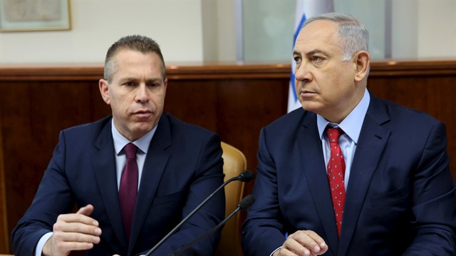 File photo: Israeli Prime Minister Benjamin Netanyahu (R) sits next to Israeli Public security Minister Gilad Erdan during the weekly cabinet meeting in Jerusalem