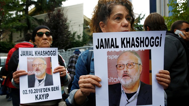 Human rights activists hold pictures of Saudi journalist Jamal Khashoggi during a protest outside the Saudi Consulate in Istanbul, Turkey October 9, 2018. 