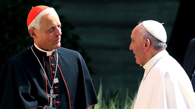Pope Francis (R) greets the Archbishop of Washington, Cardinal Donald Wuerl (L).