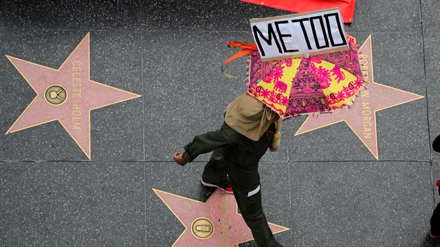 A demonstrator takes part in a #MeToo protest 