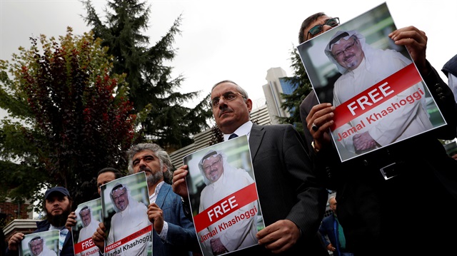 Human rights activists and friends of Saudi journalist Jamal Khashoggi hold his pictures during a protest outside the Saudi Consulate in Istanbul, Turkey.