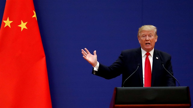 U.S. President Donald Trump delivers his speech as he and China's President Xi Jinping meet businness leaders in Beijing